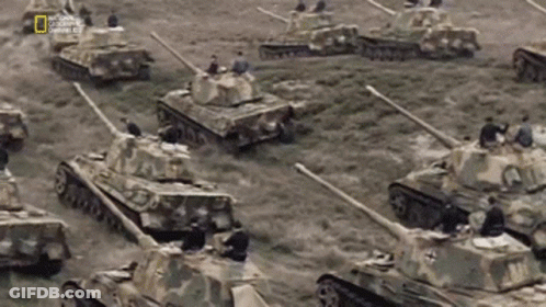 Tanks Lined Up In Field With National Geographic Logo GIF