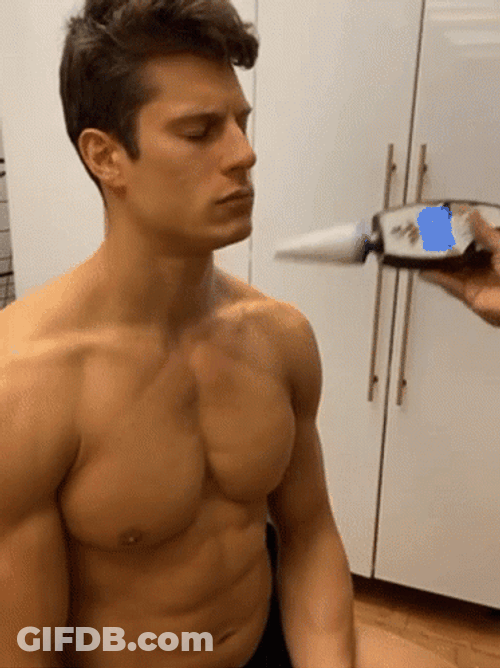 Tanning Spray On Guy's Face GIF
