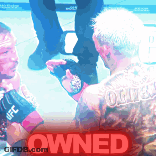 Tattooed Man Held, 'Owned' In Red GIF