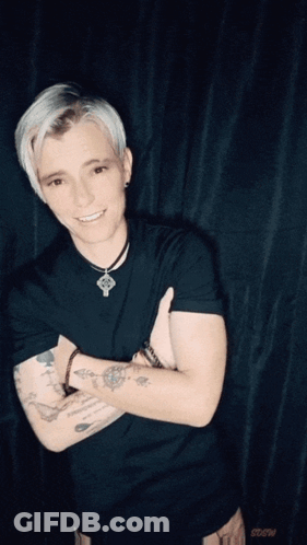 Tattooed Man Lifted By Another Man GIF