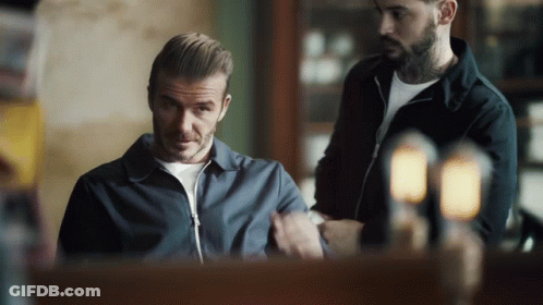 Tattooed Man Looking At Watch GIF