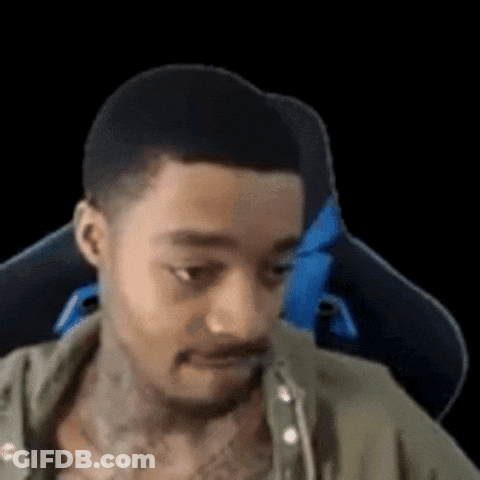 Tattooed Man Sitting In Chair GIF