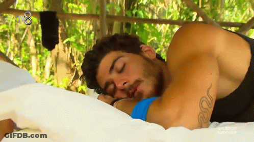 Tattooed Man Sleeping On Bed GIF