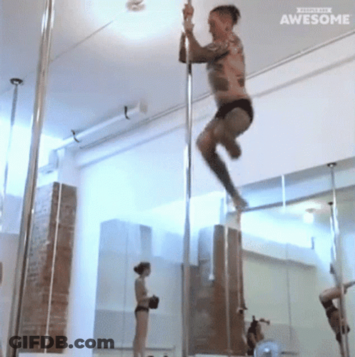 Tattooed Up Man Pole Dancing GIF