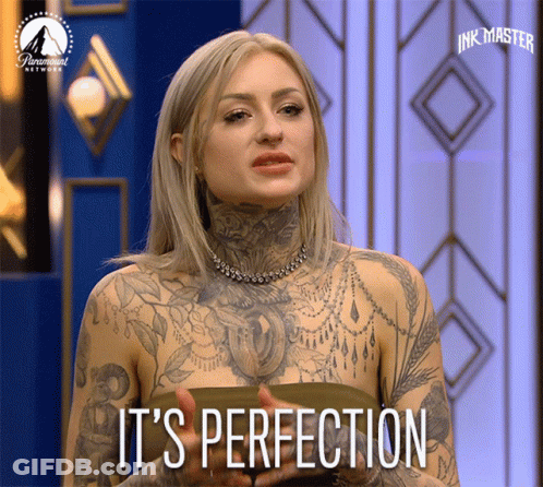 Tattooed Woman Says It's Perfection On A Screen GIF