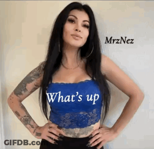 Tattooed Woman Wearing Blue Lace Top Saying Whats Up GIF