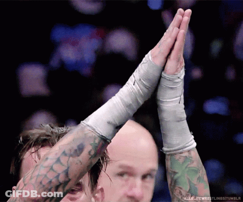 Tattooed Wrestler High Fiving Opponent GIF