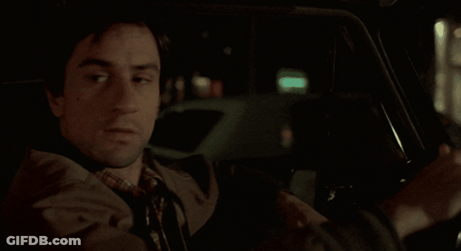 Taxi Driver Travis Bickle Looking Behind While Driving GIF