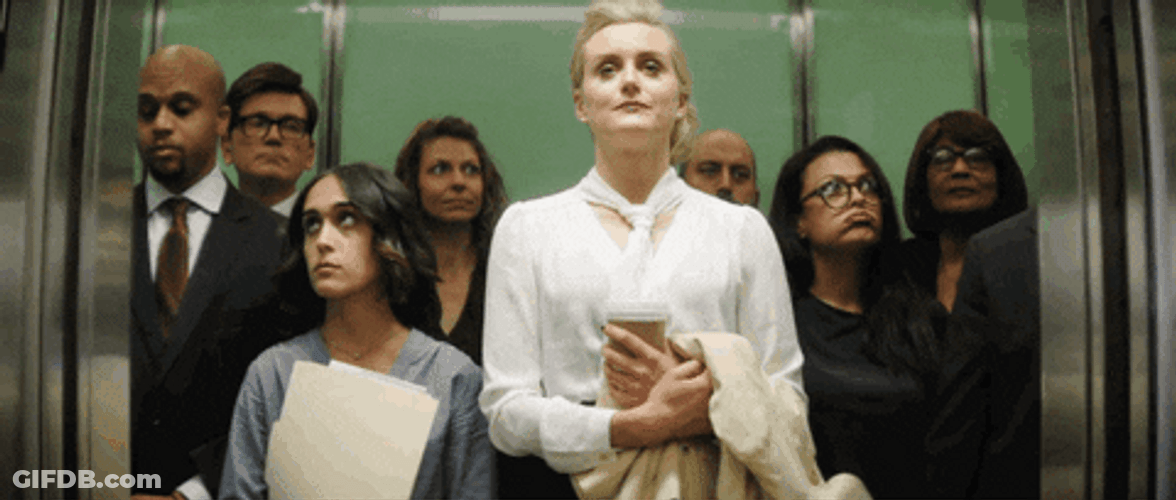 Taylor Schilling With Other People Inside Elevator GIF