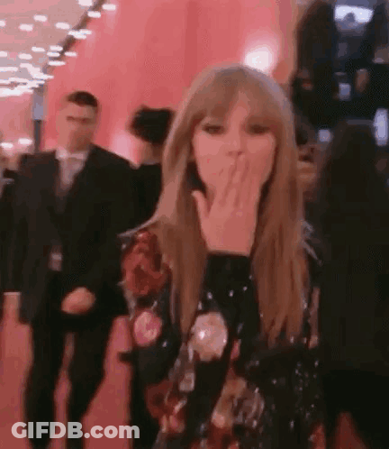 Taylor Swift Blowing A Kiss On Red Carpet GIF