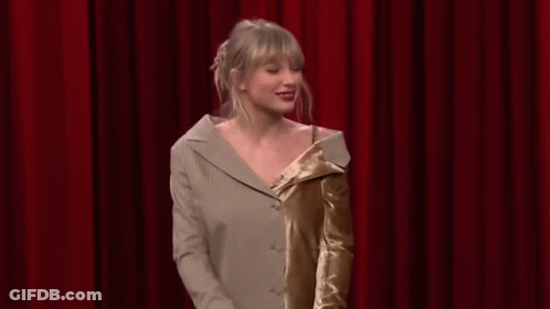 Taylor Swift Dancing On Stage In Suit And Dress GIF