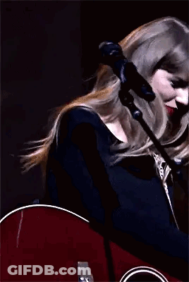 Taylor Swift Holding Guitar And Waving GIF