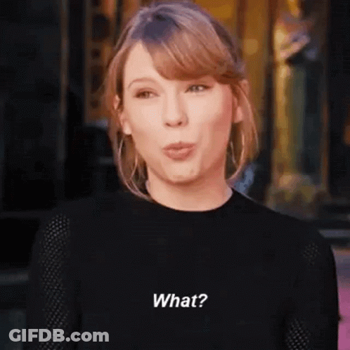 Taylor Swift In Black Sweater Making Funny Face GIF