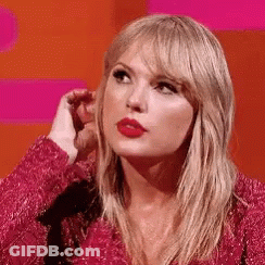 Taylor Swift In Pink Dress Hand To Ear GIF
