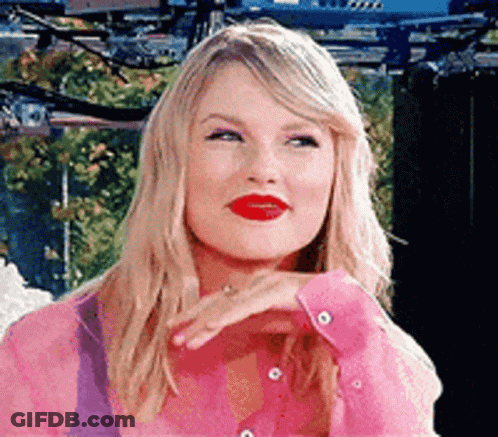 Taylor Swift In Pink Shirt Making Funny Face GIF