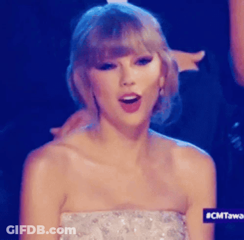 Taylor Swift In Strapless Dress Making A Face GIF