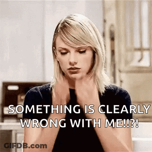 Taylor Swift Is Sitting In A Kitchen With Her Hands On Her Neck And Says Something Is Clearly Wrong With Me ! GIF