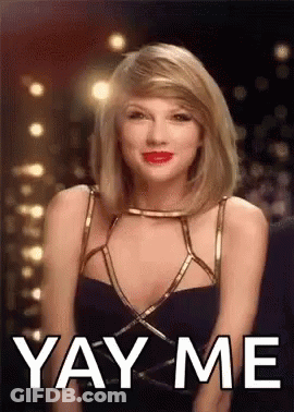 Taylor Swift Is Wearing A Black Dress And Red Lipstick And Is Making A Funny Face . GIF