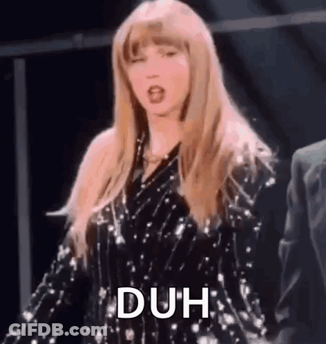 Taylor Swift Is Wearing A Sequined Dress And Dancing On Stage . GIF