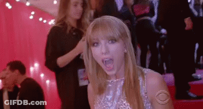 Taylor Swift Making Funny Face On Red Carpet GIF