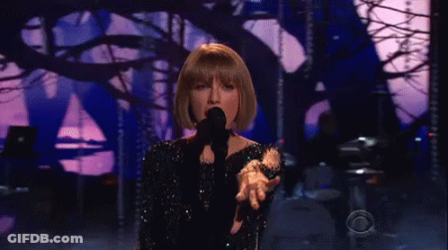 Taylor Swift Singing Into Microphone On Stage GIF