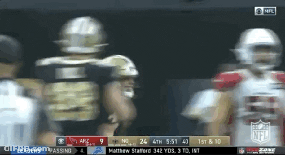 Taysom Hill Leaping While Holding Football GIF