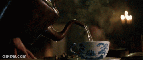 Tea Being Poured From Kettle Into Cup GIF