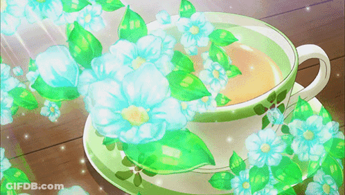 Tea Cup With Blue Flowers And Green Leaves GIF