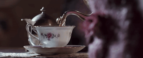 Tea Poured Into Floral Cup GIF