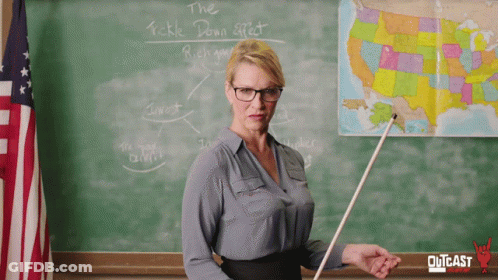 Teacher Standing In Front Of Tickle Down Effect Chalkboard GIF