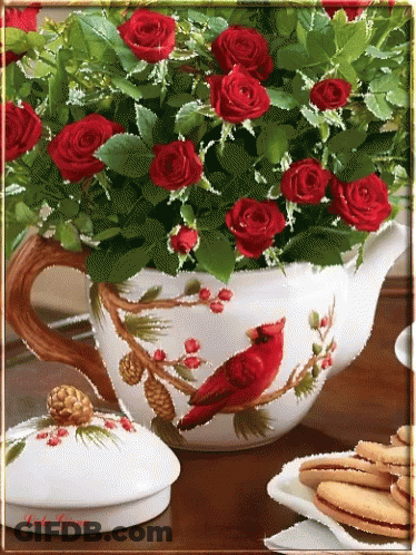 Teapot Filled With Red Roses And Cardinal GIF