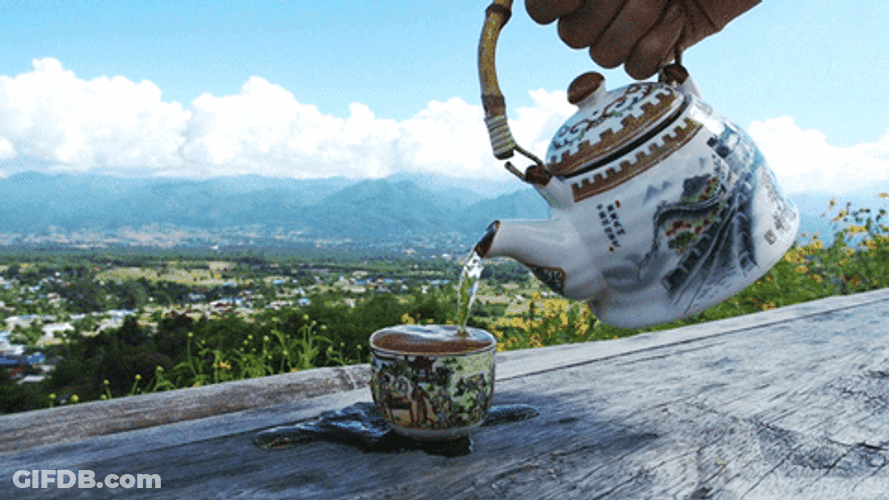 Teapot Water Pouring Fills Up Cup GIF