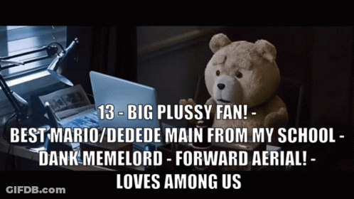 Teddy Bear At Desk With Laptop And Newspaper GIF