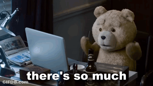 Teddy Bear At Desk With Laptop Saying There's So Much Behind Him GIF