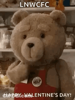 Teddy Bear Holding Heart Saying Happy Valentine's Day GIF