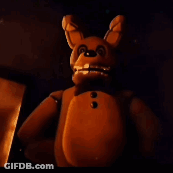 Teddy Bear Holding Knife In Dark Room GIF
