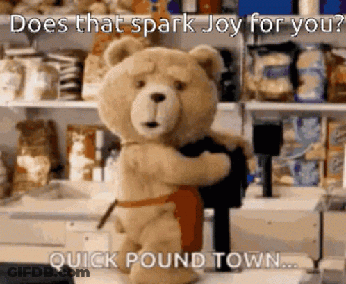 Teddy Bear In Apron Holding Black Shirt GIF