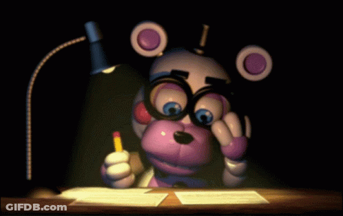 Teddy Bear In Glasses Sitting At Desk With Pencil GIF