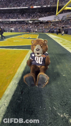 Teddy Bear In Jersey Number 90 On Football Field GIF