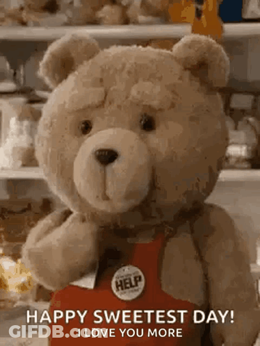 Teddy Bear In Red Apron Holding Box Says Happy Sweetest Day GIF