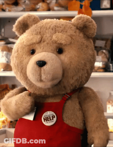 Teddy Bear In Red Apron Says Everyone Needs Help GIF