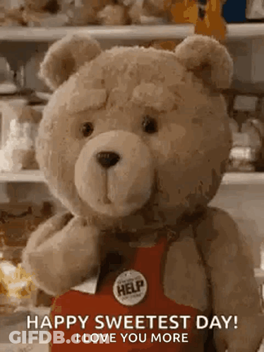 Teddy Bear In Red Apron With Help Button Holding Box GIF