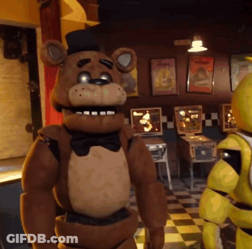 Teddy Bear In Top Hat Next To Teddy Bear In Arcade GIF