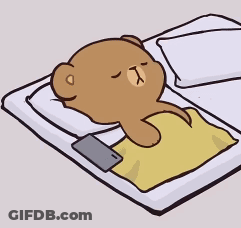 Teddy Bear Laying On Bed With Phone GIF