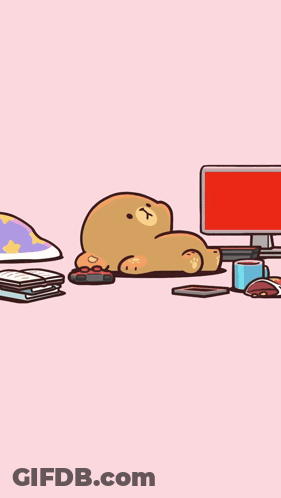 Teddy Bear Lying Next To Computer GIF