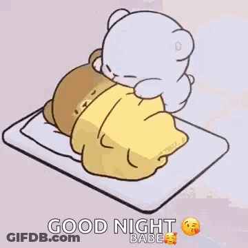 Teddy Bear Lying On Bed With Blanket GIF