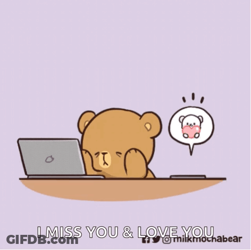 Teddy Bear Sitting At Desk Looking At Cell Phone GIF