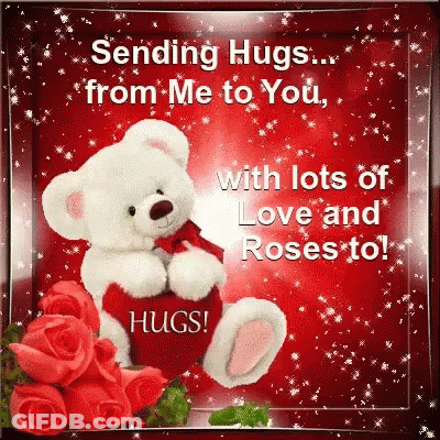 Teddy Bear Sitting Next To Red Roses GIF