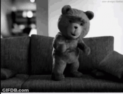 Teddy Bear Standing On Couch Black And White GIF