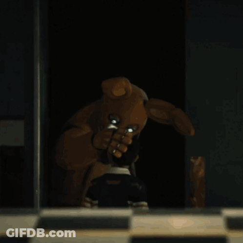 Teddy Bear With Bunny Ears In The Dark GIF